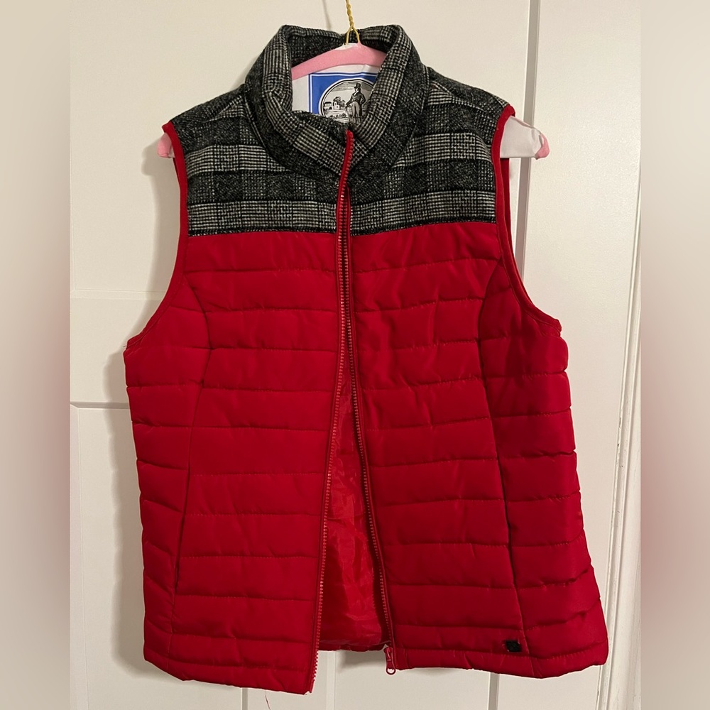 Red puffer vest with accent plaid material.